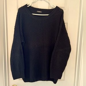 Black long sleeve thick cable sweater.
